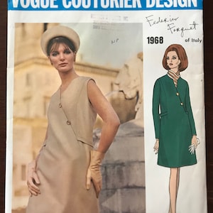 May include: Vogue Couturier Design pattern envelope featuring a model wearing a beige dress with a white hat and gloves. The envelope also features a model wearing a green dress with a white scarf. The text on the envelope reads "Vogue Couturier Design", "Federic Forquet of Italy", and "1968".