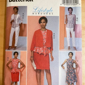 May include: A sewing pattern for a women's wardrobe with four different styles. The pattern includes a jacket, a skirt, a dress, and a top. The pattern is from Butterick and has the number B6463 on it.