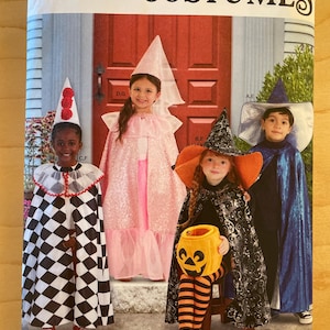 May include: Simplicity Costumes sewing pattern featuring children in various Halloween costumes. The costumes include a harlequin, a princess, a witch, and a wizard. The pattern is designed for sizes 3-8 and is easy-to-sew.