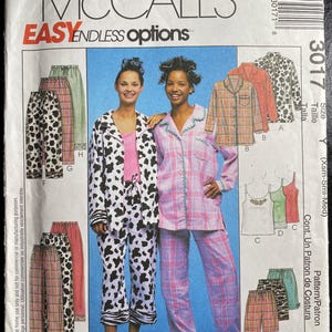 May include: McCall's sewing pattern for pajamas. The pattern features various pajama styles, including plaid and animal print designs. The package includes images of the finished garments and the text "EASY ENDLESS options".