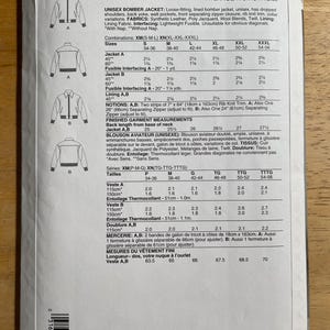 May include: A Vogue Patterns sewing pattern for a unisex bomber jacket, featuring dropped shoulders, welt pockets, and a front separating zipper. Includes fabric requirements and finished garment measurements in inches and centimeters.