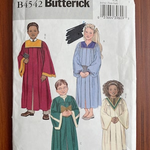 May include: A Butterick B4542 sewing pattern envelope featuring illustrations of four individuals wearing long robes. The designs include a maroon robe with yellow trim, a light blue robe, a dark green robe with white trim, and a cream robe with a striped collar.