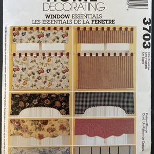 May include: McCall's Home Decorating pattern for window essentials. The package features various window treatment designs, including valances and curtains, with floral, striped, and geometric patterns. The number 3703 is visible on the package.