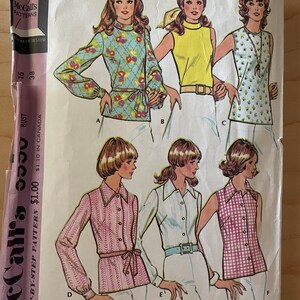 May include: A vintage sewing pattern for a set of blouses. The pattern includes six different styles, with a variety of necklines, sleeves, and patterns. The pattern is for misses' sizes 16 and 38. The pattern is called "McCalls 5550" and is a step-by-step pattern. The pattern is £1.00 in the UK and £1.10 in Canada.