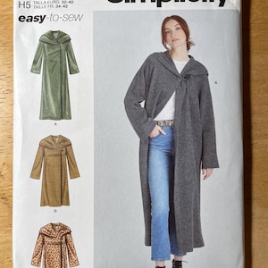 May include: Simplicity sewing pattern S9684 for a long coat. The pattern includes illustrations of the coat in green, brown, and animal print. The cover features a woman wearing a gray coat. The text "easy-to-sew" is visible.