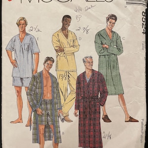 May include: A sewing pattern for pajamas with four different styles. The pattern includes instructions for making a long-sleeved pajama top, a short-sleeved pajama top, a pair of pajama pants, and a robe. The pattern is for sizes 41/4, 2 7/8, 2 1/2, and 4 1/8.