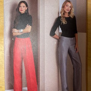 May include: Vogue Patterns sewing pattern V1988. The pattern features two women modeling different outfits. One outfit includes red wide-leg trousers and a black top. The other outfit includes grey wide-leg trousers and a black top. Printed in the USA.