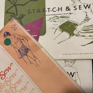 May include: Vintage sewing patterns for men's swimwear. The patterns feature illustrations of men in swim trunks and the text "S-T-R-E-T-C-H & SEW". The patterns include sizing information and are designed for knit fabrics.