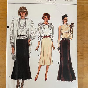 May include: A sewing pattern for three different skirt styles. The pattern is for sizes 8-10-12. The pattern is called "Very Easy Very Vogue" and the pattern number is 9790.