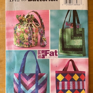 May include: A sewing pattern for four different bags, including a drawstring bag, a tote bag with a chevron pattern, a tote bag with a diamond pattern, and a tote bag with a geometric pattern. The pattern is called "Butterick B4248" and is designed for use with "Fat Quarters" fabric.