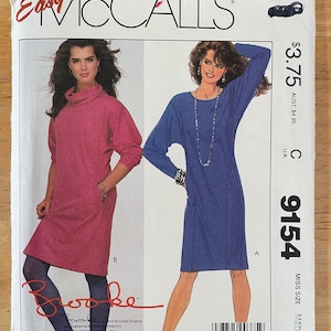 McCalls 9154 Pattern UNCUT 1980s Brooke Shields Stretch Knit Cowl or Crew Neck Pullover Dress Dolman Sleeve Pockets Size Medium