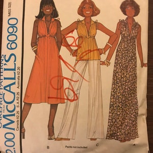 May include: A vintage sewing pattern for a dress or top. The pattern is for misses' sizes and includes three different styles. The pattern is from McCall's and is number 6090. The pattern is priced at £2.00.