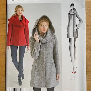 May include: A sewing pattern package featuring a woman in a red coat and a woman in a gray coat with a hood. The package includes the text "Leanne Marshall" and "1254 D5". The package also includes a drawing of a coat.