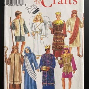 May include: Simplicity Crafts pattern 8152, size A (XS-XL). The pattern features illustrations of various biblical costumes, including kings, angels, and figures in robes. The word "Crafts" is in red script.