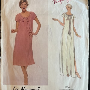 May include: Vogue American Designer pattern for a nightgown. The pattern is for a long, flowing gown with a tie at the neck. The pattern is by Leo Narducci and is number 1914.