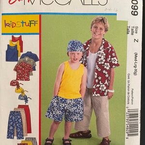 May include: A sewing pattern for kids clothing, McCall's pattern number M6099, size Z (Med-Lrg-Xlg). The pattern includes instructions for making a Hawaiian shirt, shorts, and a bandana.