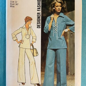May include: A sewing pattern for a two-piece outfit. The pattern is for a size 12, bust 34 inches. The outfit includes a long-sleeved blouse with a lace-up front and wide-leg pants. The pattern is from Simplicity, designer fashion, and costs $1.50.