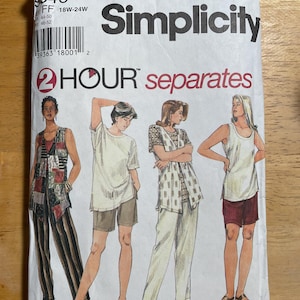 May include: A Simplicity sewing pattern envelope featuring illustrations of four different outfits. The envelope is white with the Simplicity logo and the text "2 HOUR separates". The outfits include shorts, pants, and tops in various styles.