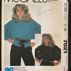 May include: A sewing pattern for a large size women's blouse with a 90 minute average sewing time. The pattern is from McCall's and is called "Burruss".