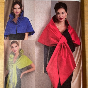 May include: Vogue Patterns sewing pattern featuring three different cape designs. The pattern includes a blue, chartreuse, and red cape. The pattern is labeled V1991 and includes the names Tom and Linda Platt.