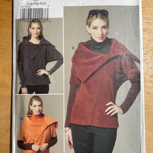 May include: Vogue Patterns designer original sewing pattern V8778. The pattern features three views of a jacket with a unique collar design. The jacket is shown in shades of brown and orange. The pattern includes sizes Lrg-XXL.