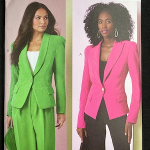 May include: Vogue Patterns sewing pattern featuring two women modeling tailored blazers and pantsuits. One suit is bright green, the other is hot pink. The pattern number is V2016, with sizes H5 (6-8-10-12-14).