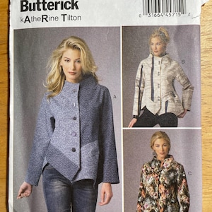 May include: Butterick sewing pattern B6106 by Katherine Tilton for a jacket with a high collar and asymmetrical button closure. The envelope displays three variations: a blue patterned jacket, a light-colored jacket, and a floral print jacket.