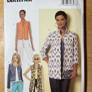 May include: A Butterick sewing pattern envelope, B6328, with illustrations of women's jackets and vests. The envelope includes the text "Designed and printed in USA."