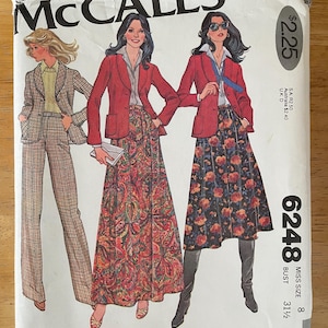 May include: Vintage McCall's sewing pattern for a skirt and jacket. The pattern is for size 8, bust 31 1/2 inches. The pattern features a red jacket with a floral skirt and a second model wearing a red jacket with a black and floral skirt. The pattern is from the Carefree Patterns collection.