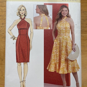 May include: A Butterick sewing pattern, B6942, showing illustrations of halter dresses. One dress is red, the other is yellow with a geometric pattern. The pattern includes size options B5 (8-10-12-14-16).