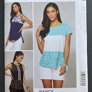 May include: McCall's sewing pattern featuring three top designs. The pattern includes options with simple instructions. The designs include a navy blue top with white accents, a black top with white stripes, and a white top with turquoise details.