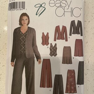 May include: Simplicity sewing pattern #792, easy chic, for sizes 4, 6, 8, 10, UK 30-36, FR 32-38. The pattern includes instructions for a blazer, vest, trousers, and skirt.