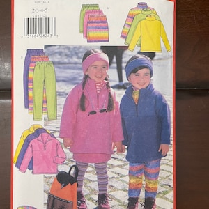 May include: A sewing pattern for children's clothing, featuring a pink, blue, and yellow striped skirt, a yellow turtleneck sweater, a pink sweater, a blue sweater, and a pair of rainbow striped pants. The pattern is from Butterick and is number 5715.
