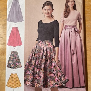 May include: Simplicity sewing pattern 3743 featuring skirt designs. The pattern includes illustrations of various skirt styles, including a pleated floral skirt and a solid pink skirt. The cover also shows two women wearing the skirts. Size U.S. 6-14.