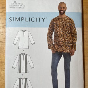 May include: Simplicity sewing pattern S9158 featuring a long-sleeved shirt design. The pattern includes size information in U.S. sizes 44-52. The image shows a man wearing a patterned shirt and jeans.
