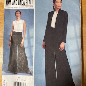 May include: A sewing pattern titled "TOM AND LINDA PLATT" featuring two images of a woman wearing a black suit and wide-leg pants. The pattern includes the text "VOGUE PATTERNS AMERICAN DESIGNER" and size information.
