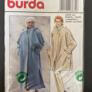 May include: A Burda sewing pattern packet featuring illustrations of a jacket and coat. The packet includes the Burda logo, size information, and the text "JACKET and COAT". The main image shows a woman wearing a light blue coat and another wearing a tan coat.
