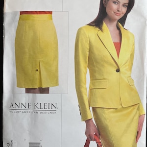 May include: A yellow skirt suit pattern by Anne Klein. The pattern includes a skirt and a blazer. The model in the image is wearing the suit. The pattern is labeled V2853 and is for sizes 18-22.