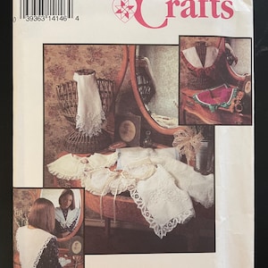 May include: Simplicity Crafts sewing pattern number 8465, one size, for a white lace collar. The pattern shows a woman wearing the collar, and a close-up of the collar on a table.