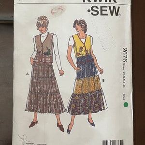 May include: A sewing pattern for a vest and skirt. The pattern is for sizes XS-S-M-L-XL. The pattern is from Kwik-Sew Pattern Co., Inc. and is number 2676.