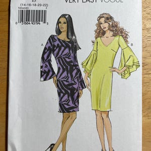 May include: A sewing pattern for Very Easy Vogue dresses. The pattern features two dress designs: one with a purple and black zebra print and the other a solid yellow dress. The pattern number is V8945, size E5.