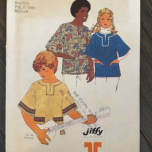 May include: Simplicity sewing pattern number 6864 for a boy or girl's shirt. The pattern includes two main pattern pieces and instructions for zig zag stitching. The pattern is for young juniors and teens, and the model is wearing a yellow shirt with brown trim.
