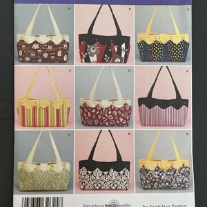 May include: Simplicity sewing pattern 2676 featuring various tote bag designs. The bags showcase diverse patterns, including coffee cups, floral prints, and geometric shapes. The pattern includes the text "ONE SIZE" and "Sign-up for our free newsletter today at simplicity.com".