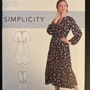 May include: Simplicity sewing pattern S9041. The pattern includes illustrations of three different dress styles. The cover features a woman wearing a long-sleeved dress with a floral print. The pattern size is U.S. 16-24.