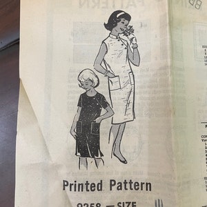 May include: A vintage sewing pattern for a dress with a black and white polka dot print. The pattern is for size 10 and is called "Printed Pattern 9258".