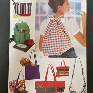 May include: A Butterick pattern envelope featuring various tote bags, a backpack, and a drawstring bag. The bags showcase diverse designs, including stripes, floral prints, and solid colors. The text "4968" and "Butterick" are visible.