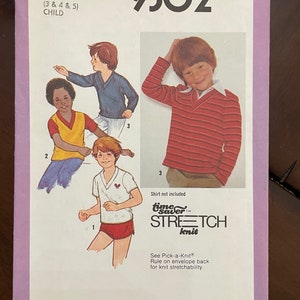 May include: Simplicity sewing pattern number 9302 for children's clothing. The pattern includes three sizes: 3, 4, and 5. The pattern is for a shirt and shorts. The pattern is for knit fabric. The pattern is a time saver stretch knit pattern.