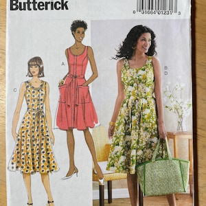 May include: Butterick sewing pattern B6674 for dresses. The pattern features illustrations of three different dress styles, including a button-down dress with pockets and a floral print dress. The pattern size range is 6-8-10-12-14.
