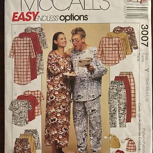May include: A sewing pattern for a pajama set with a newspaper print design. The pattern includes a long-sleeved shirt, pants, and a hat. The pattern is for sizes small, medium, and large. The pattern is from McCall's Easy Endless Options.