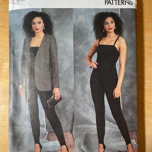 May include: Vogue Patterns sewing pattern showing two women's outfits. One outfit includes a blazer, leggings, and heels. The other outfit is a jumpsuit with spaghetti straps and heels. The pattern is labeled V1913, size YS (18-20-22-24-26).